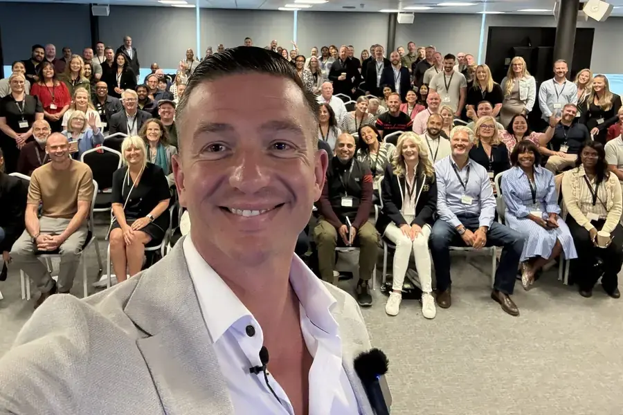 Steve Doran with a full room of Academy members at a live training event